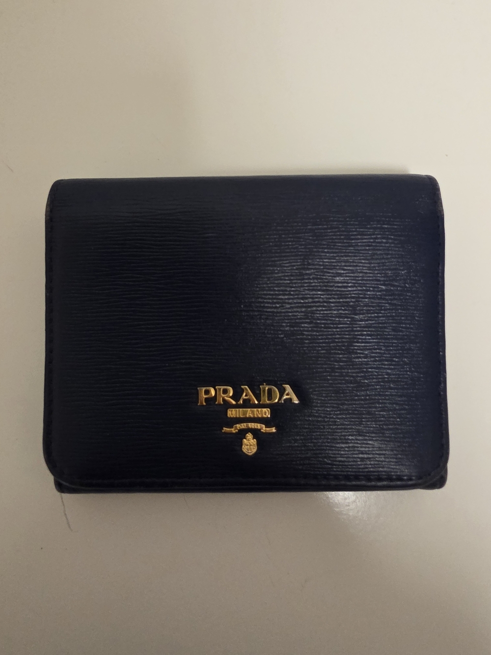 Prada Men's Navy Leather Compact Wallet with Gold Logo